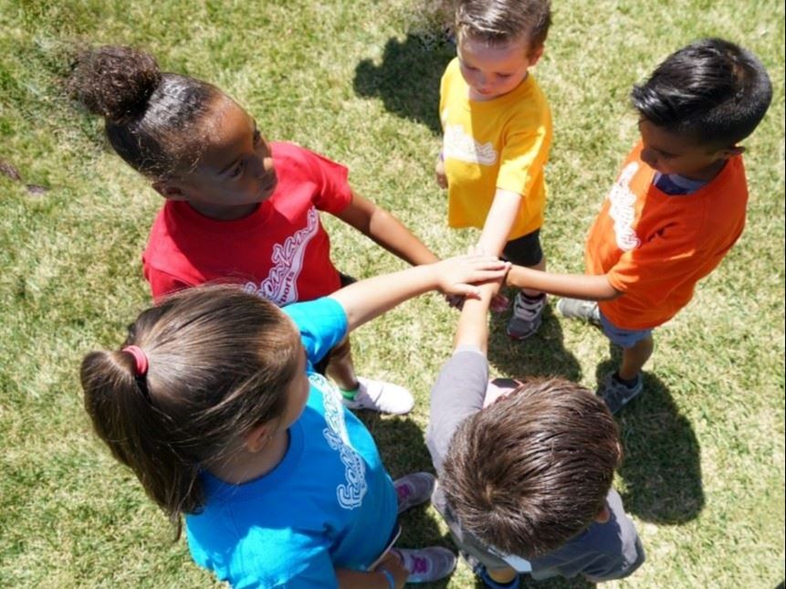 Youth holding hands in a circle
